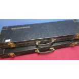 Two Winchester hard gun cases with fitted interiors to fit 30 inch barrels