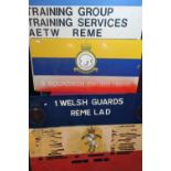 Three military boards including metal sign for One Welsh Guards Reme Lad, another for Training Group