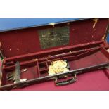 Vintage leather and brass mounted gun case with trade label for Robert Jones Gun and Rifle Maker