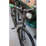 Vintage rally bicycle with chrome headlamp and rear parcel shelf, (possibly home guard issue)