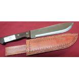 Short Dolo machete with 9 inch swollen blade, two piece wooden grips and tooled leather sheath, with