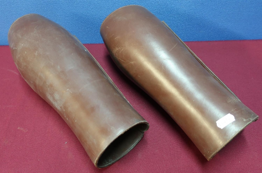 Pair of early - mid 20th C tan leather button sided gaiters, the internal label with gilt