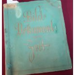 A copy of Bild-Dokumente Unferer Feit Cosmos Dresden book album of photographic prints depicting the