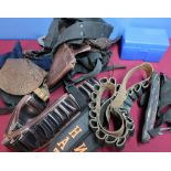 Box containing a quantity of various assorted cartridge belts, sight covers, slings, etc
