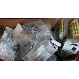 Box containing a large quantity of various gun parts and accessories including trigger mechanisms,