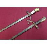Two 19th C French/Belgium tri-form bayonets, the top straps dated 1878 with brass and wood grips,