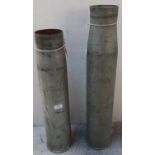 Large alloy shell casing for GunM68 105mm (height 61cm) and a similar alloy casing with Russian type