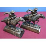 Pair of Winchester cast metal advertising figures (18cm high)
