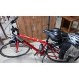 Cannon dale gents street bike with various accessories including wheel lock, helmet, saddle bags and