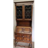1930's Jacobean style oak bureau bookcase, two leaded glass doors over fall front two frieze drawers
