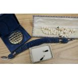 Boxed Estee Lauder compact, Miser type purse with woven and beadwork detail, cased mother of pearl