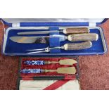 Cased 3 piece antler handled carving set and a stahlbronce copper and ceramic butter knife and