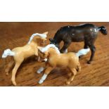 Three Beswick foals, including two palomino