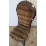 Victorian mahogany framed nursing style chair with upholstered seat and back and carved detail