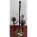 19th/20th C three branch brass oil lamp with turned circular base complete with chimneys (mounts