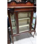 Edwardian mahogany inlaid cabinet enclosed by single glazed door with stained glass and stained lead