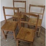Set of four light wood school type chairs
