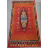 Contemporary middle eastern burnt orange ground rug or wall hanging (149cm x 80cm)