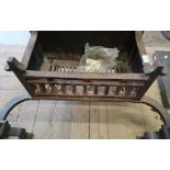 Wrought metal baronial style fire basket and fire dog supports with shield shaped crests (width