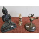 Cast bronze figure of Buddha, a cast bronze figure of a Crane and a carved African tribal head