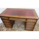 Modern oak Edwardian style twin pedestal desk with leather insert top, central drawer flanked by two