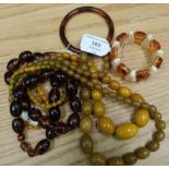Collection of various costume jewelry, amber coloured necklaces, amber and silver earrings, beads,