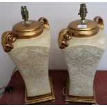 Pair of Oriental style table lamps of square tapering design, decorated with lotus leaves and