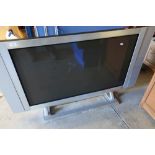Large Tiny flatscreen TV with integrated side speakers on stand, in silver finish (43 inches)