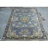 Oriental pattern wool rug, grey ground with floral pattern border (202cm x 297cm)