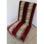 Victorian low seated nursing type chair with upholstered seat and back, on turned mahogany supports