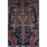 20th C traditional Persian patterned red & blue ground rug (189cm x 135cm)