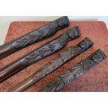Four carved mahogany supports in the forms of female heads (length approx 74cm)