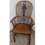 Yew and elm wood stickback Windsor armchair with H shaped understretcher on turned supports