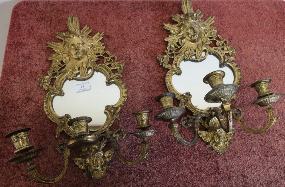 Pair of gilt metal three branch candelabra wall mirrors, crested with cherub faces (approx height