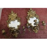 Pair of gilt metal three branch candelabra wall mirrors, crested with cherub faces (approx height