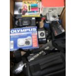 Large collection of cameras including Olympus digital camera, Olympus film cameras, Kodak 127, JVC