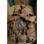 20th C Black Forest beech wall clock carved with hunting motifs