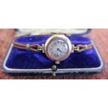 9ct gold cased ladies wrist watch by Reid with leather strap