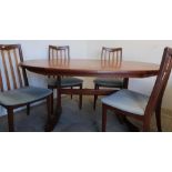 G Plan teak oval extending dining table, and a set of four chairs