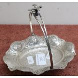 Indian white metal oval shaped Bonbon style basket with swing handle crested with a bird, with