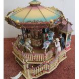 A boxed carousel royale deluxe action luminated musical figure