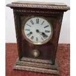 Early 20th C American beech cased shelf clock, with two train movements striking on a bell