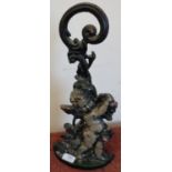 Heavy cast metal doorstop in the form of a cherub (height 42cm)