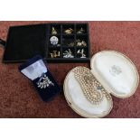 Selection of costume jewelry including simulated pearl necklace, various gents cuff links, 1977