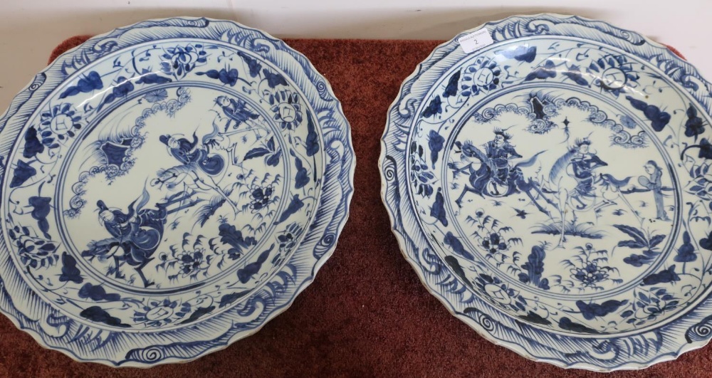 Large pair of Chinese blue & white shallow chargers with central panels depicting figures on