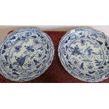 Large pair of Chinese blue & white shallow chargers with central panels depicting figures on
