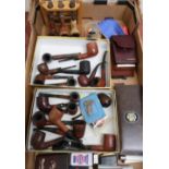 Large quantity of various smoking paraphernalia including large collection of pipes, pipe racks,