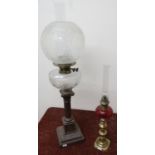 19th/20th C oil lamp with cut clear glass reservoir and etched glass shade on cast metal base (