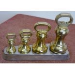 Large Victorian set of four graduating brass weights with stand