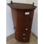 Small mahogany bowfront single door wall mounted corner cabinet